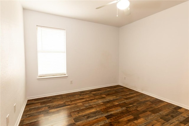 unfurnished room featuring ceiling fan, baseboards, and dark wood-style floors