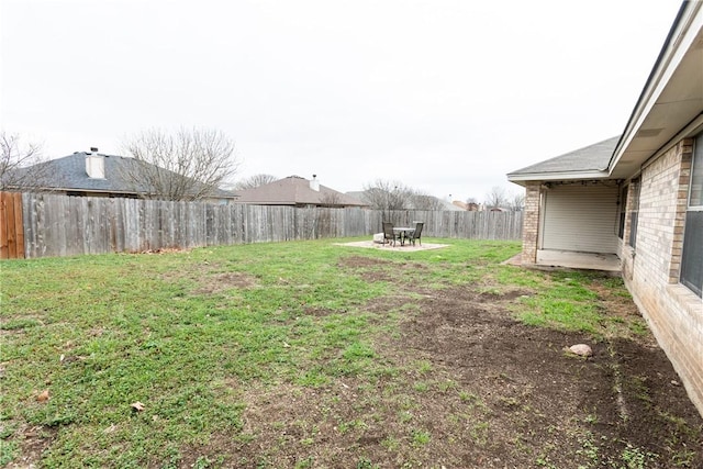 view of yard featuring a patio and a fenced backyard