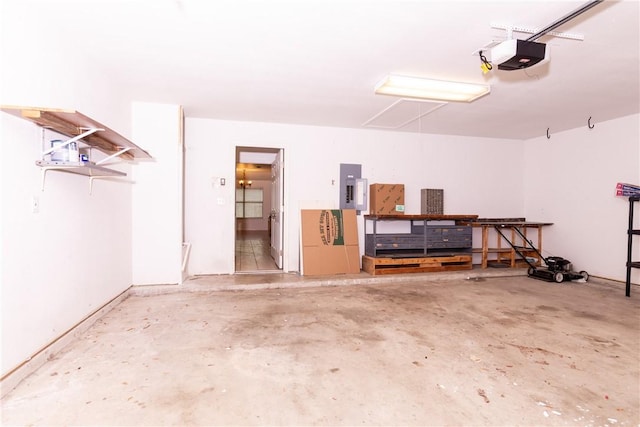 garage with electric panel and a garage door opener