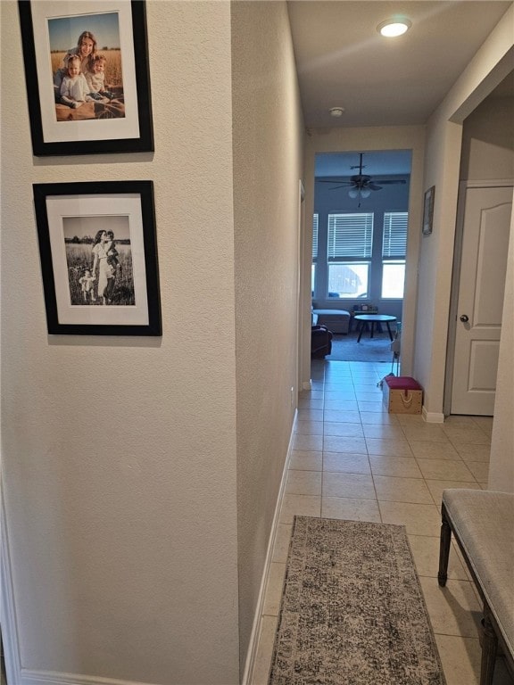 hallway with light tile patterned floors