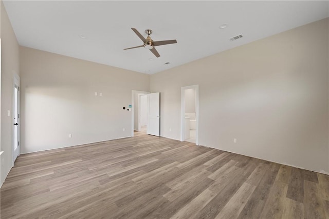 unfurnished bedroom with ceiling fan, light hardwood / wood-style flooring, and ensuite bath