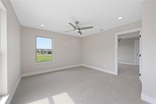 carpeted empty room with ceiling fan