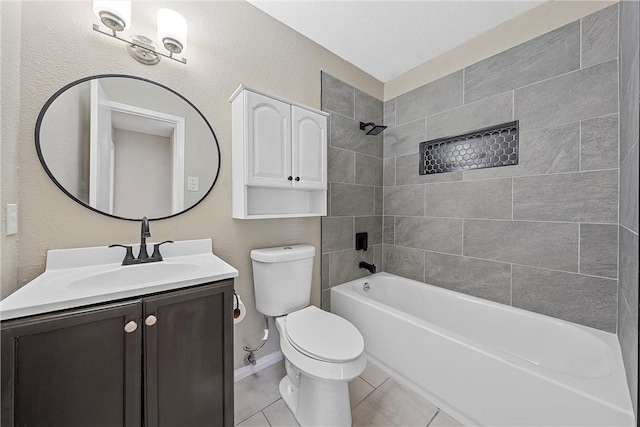 full bathroom featuring tile patterned floors, toilet, vanity, and tiled shower / bath