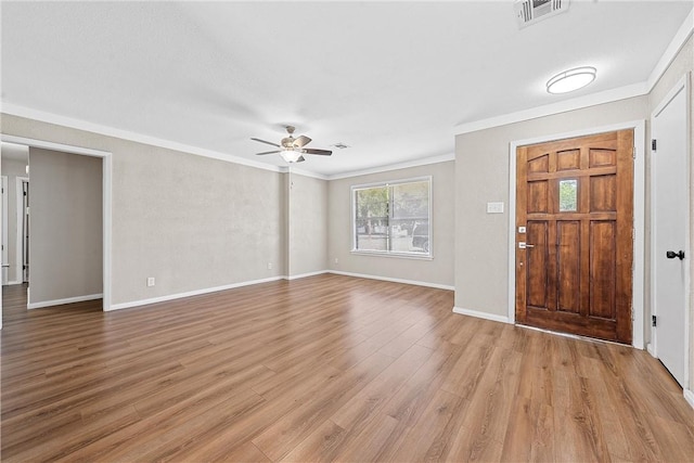 entrance foyer with ceiling fan, light hardwood / wood-style floors, and crown molding