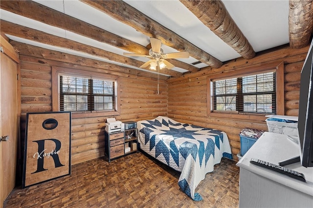 bedroom with ceiling fan, dark parquet flooring, beam ceiling, and multiple windows