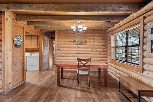 dining area featuring beamed ceiling, hardwood / wood-style flooring, separate washer and dryer, and a notable chandelier