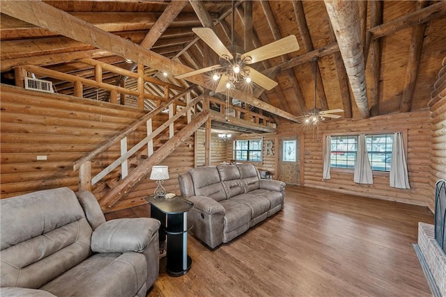 unfurnished living room with beamed ceiling, ceiling fan, hardwood / wood-style floors, and high vaulted ceiling