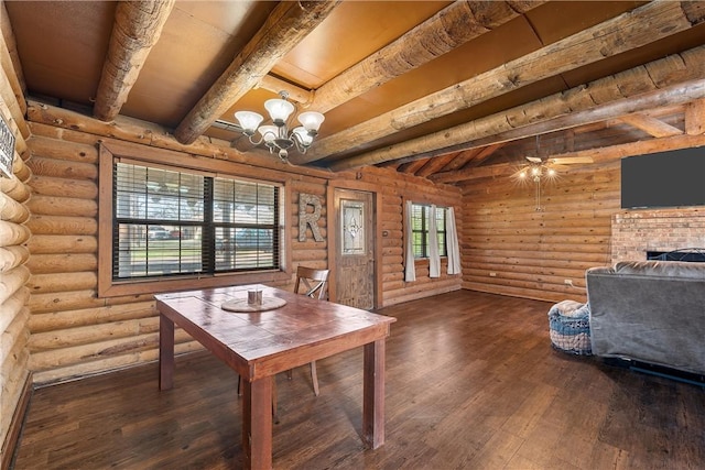 dining room featuring hardwood / wood-style floors, ceiling fan with notable chandelier, plenty of natural light, and log walls