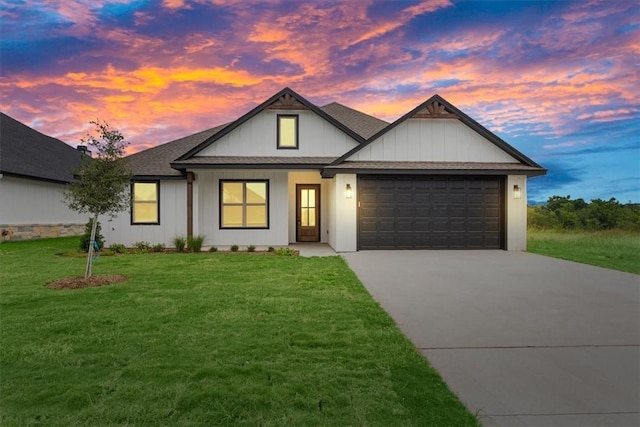 view of front of house with a lawn and a garage