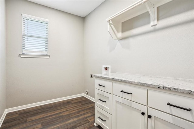 washroom featuring hookup for an electric dryer, hookup for a washing machine, cabinets, and dark wood-type flooring