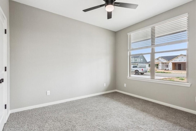 carpeted empty room with ceiling fan