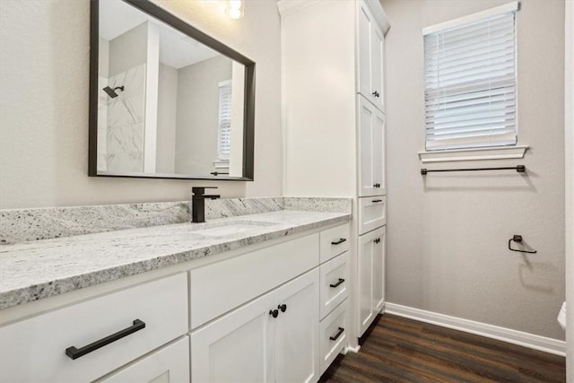 bathroom with vanity and wood-type flooring