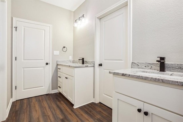 bathroom with vanity and hardwood / wood-style flooring