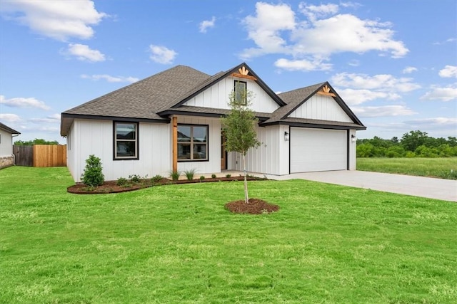 view of front of home featuring a garage and a front lawn