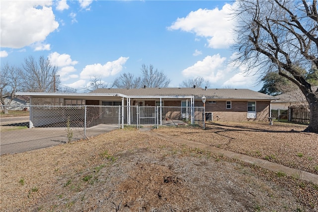 view of front of property featuring a carport