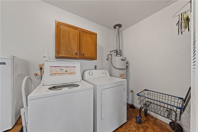 laundry room featuring independent washer and dryer, cabinets, and gas water heater