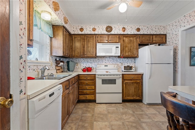 kitchen featuring ceiling fan, white appliances, sink, and tasteful backsplash