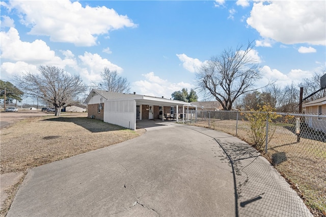 view of front of property with a carport and a front yard