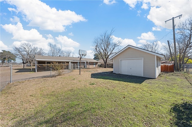 view of yard with a garage and an outdoor structure