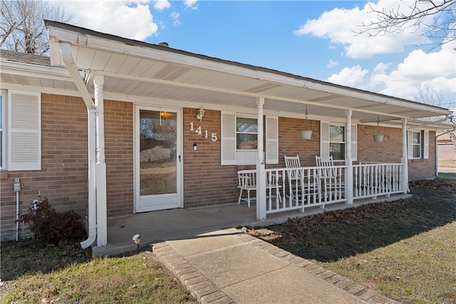 doorway to property featuring a porch