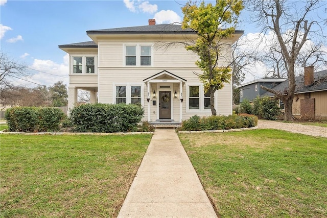 view of front of house with a front lawn