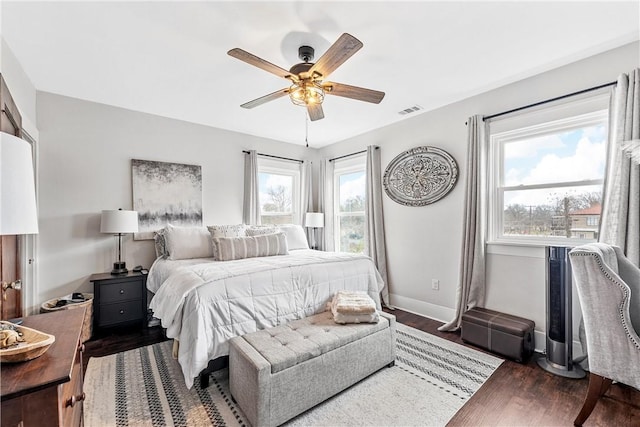 bedroom with dark wood-type flooring and ceiling fan