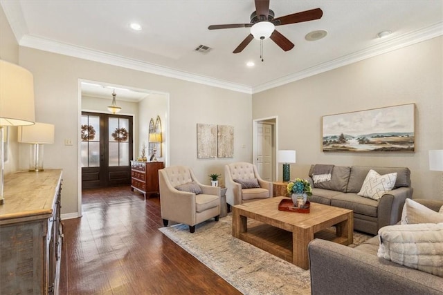 living area with crown molding, recessed lighting, visible vents, and dark wood finished floors