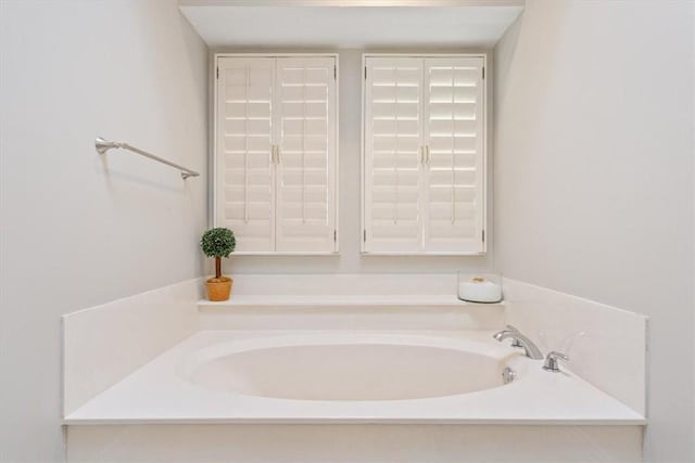 bathroom with a garden tub