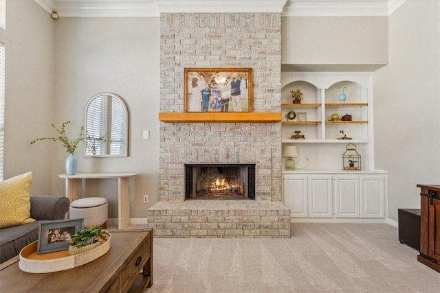 living area with ornamental molding, light carpet, and a fireplace