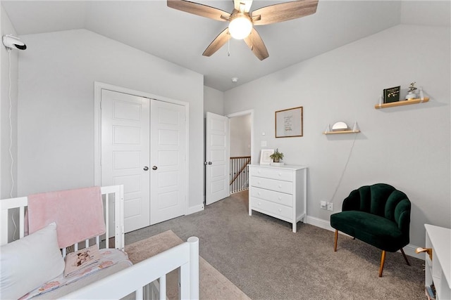 carpeted bedroom featuring ceiling fan, a closet, and vaulted ceiling