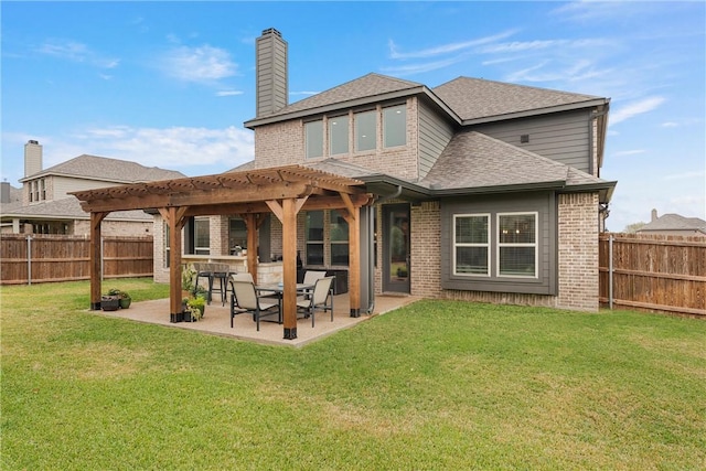 rear view of property with a lawn, a pergola, and a patio