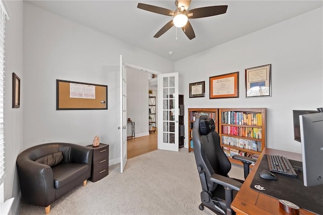 office area featuring ceiling fan, light carpet, and french doors