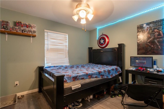 bedroom with ceiling fan and hardwood / wood-style flooring