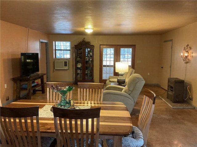 dining space featuring cooling unit and concrete floors