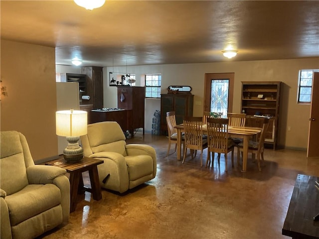 dining room with concrete floors