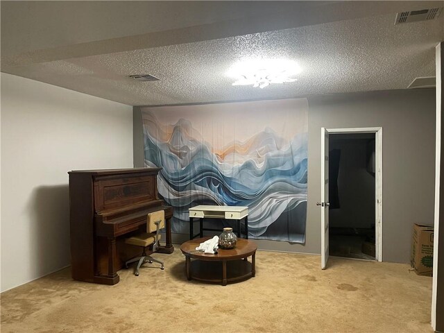 carpeted dining space with a textured ceiling