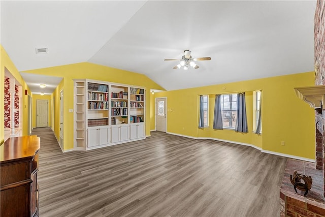 unfurnished living room with hardwood / wood-style flooring, ceiling fan, and vaulted ceiling