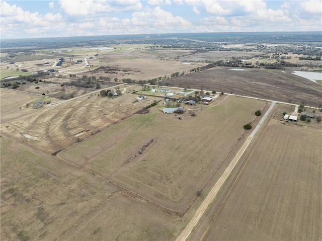 birds eye view of property featuring a rural view