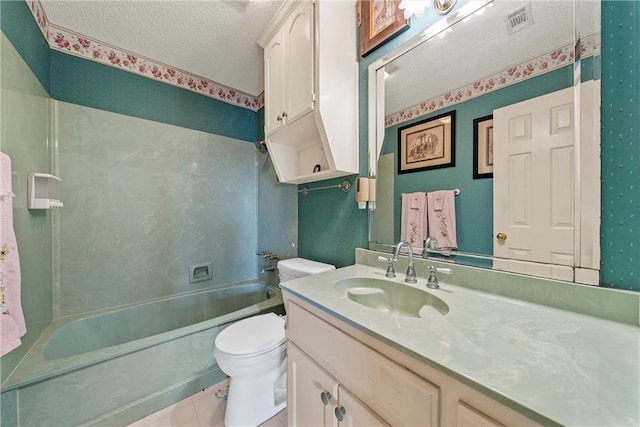 full bathroom with  shower combination, vanity, a textured ceiling, tile patterned floors, and toilet