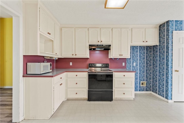 kitchen featuring a textured ceiling, electric range oven, and white cabinets