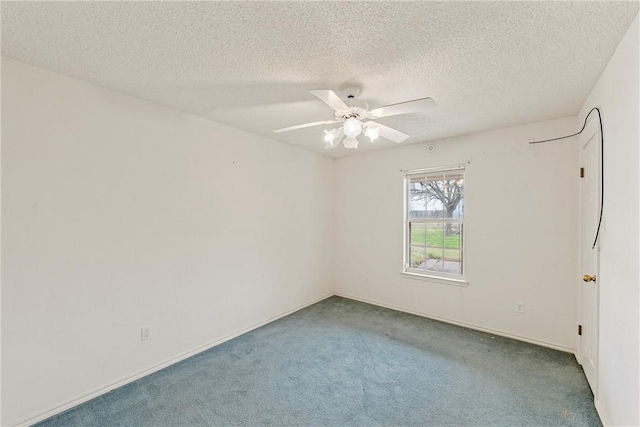 empty room with carpet flooring, a textured ceiling, and ceiling fan