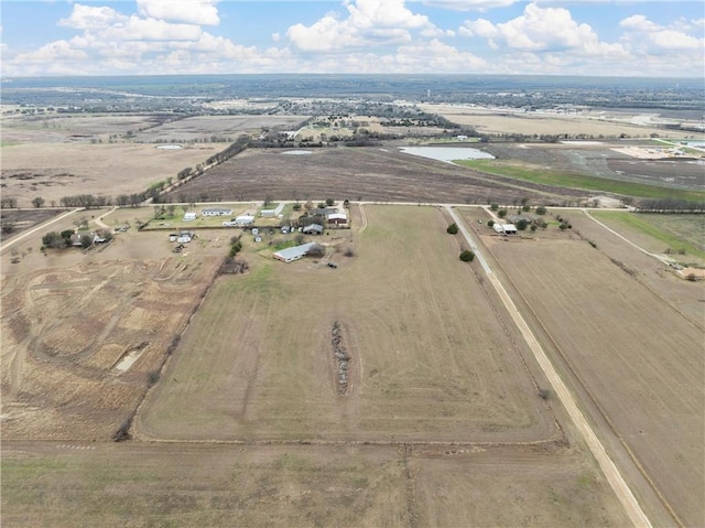 drone / aerial view featuring a rural view and a water view