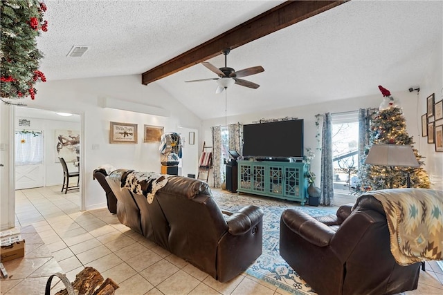 tiled living room with lofted ceiling with beams, ceiling fan, and a textured ceiling