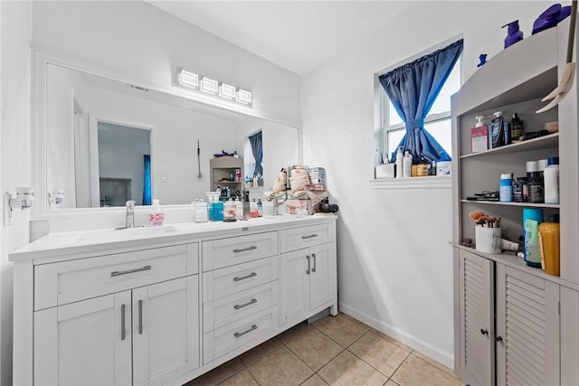 bathroom with tile patterned floors and vanity