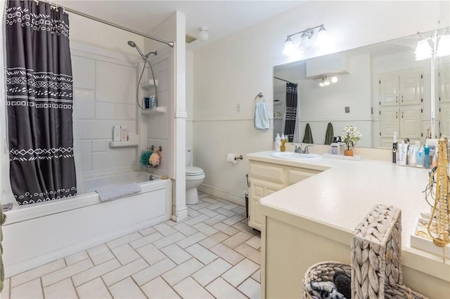 full bath with toilet, shower / bathtub combination with curtain, and vanity