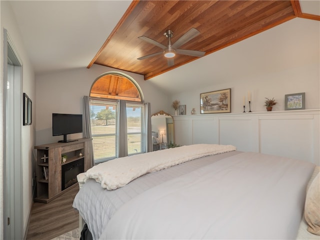 bedroom with wood-type flooring, lofted ceiling, wood ceiling, and ceiling fan