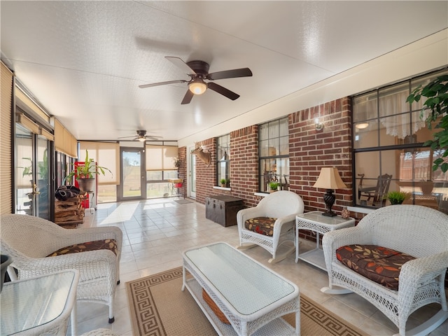 sunroom with ceiling fan