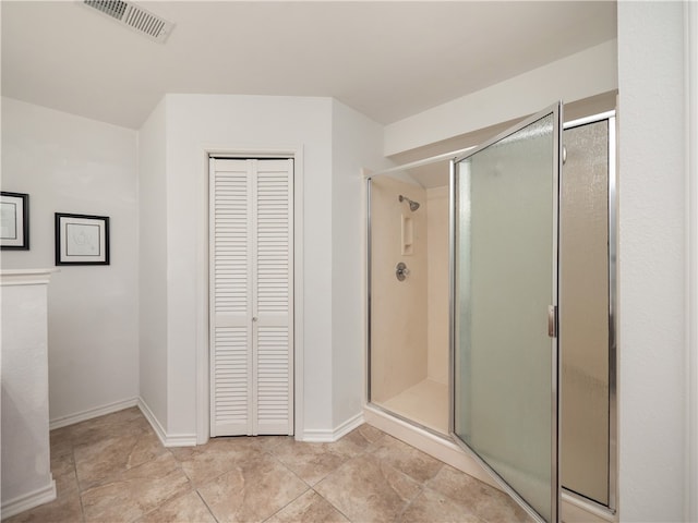 bathroom featuring a shower with door