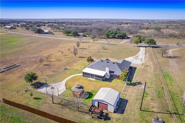 birds eye view of property featuring a rural view