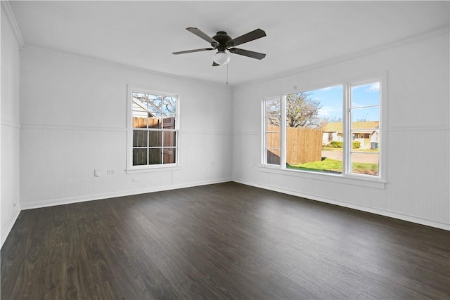 spare room with ceiling fan and dark hardwood / wood-style flooring